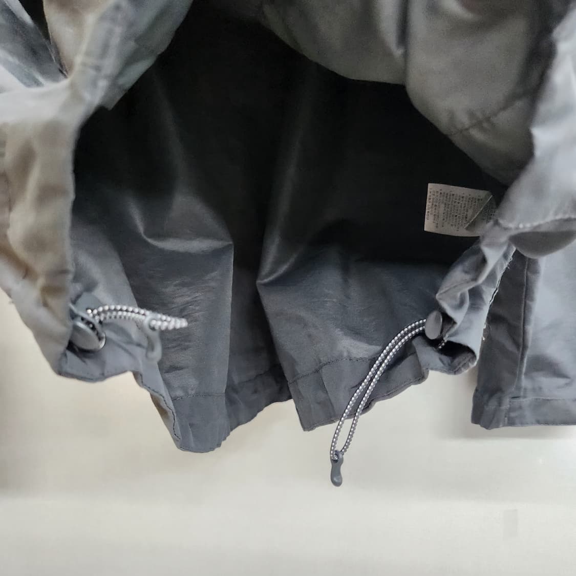 노스페이스 로고 사이드포켓 스트링 바람막이 L(L) 상품이미지5