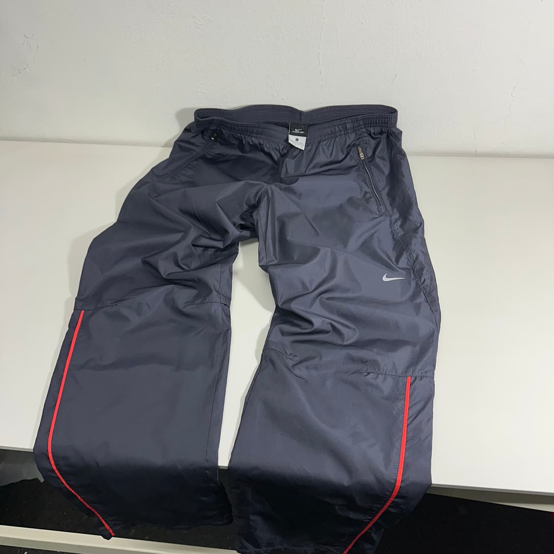 우먼M-L 나이키 다크네이비 레귤러핏 바람막이 팬츠 상품이미지1