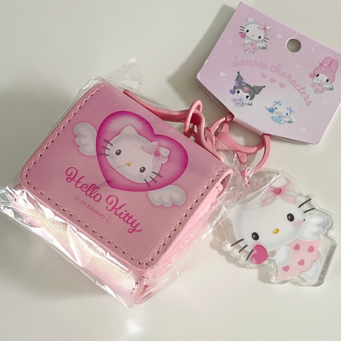 헬로키티 엔젤 이어폰 파우치 키링 글리터핑크 상품이미지1