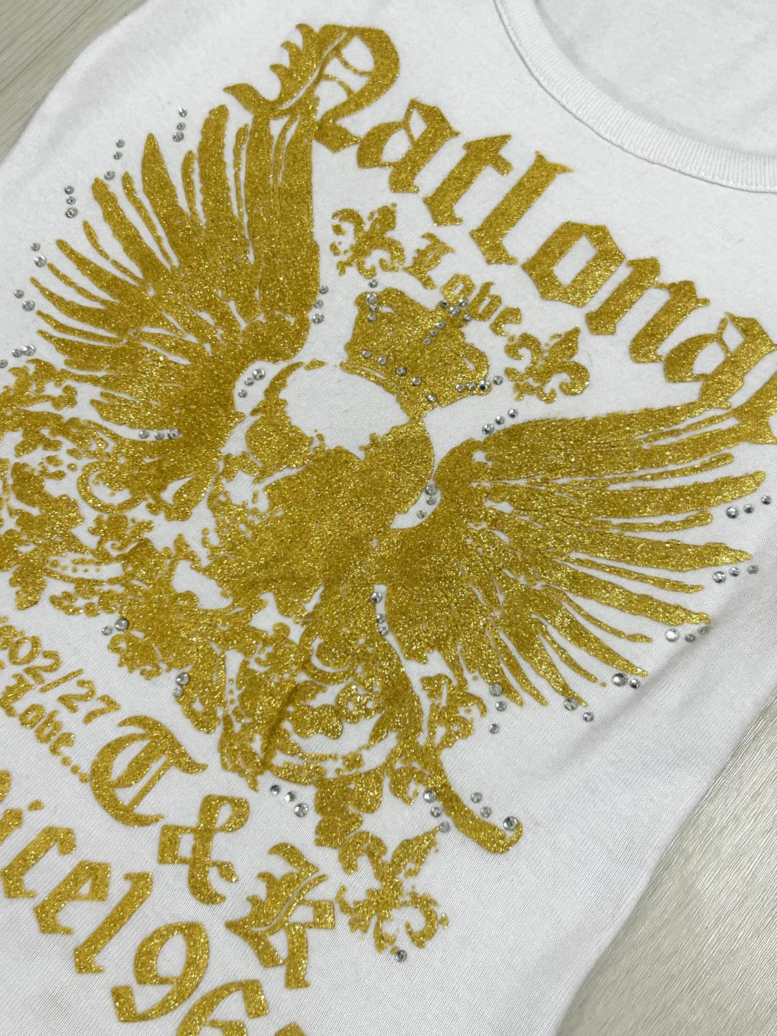 Garnet 골드윙 스컬 프린팅 큐빅 글리터 탑 상품이미지2