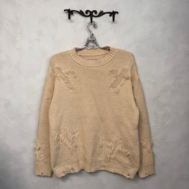Ivory grunge damage cross detail knit
