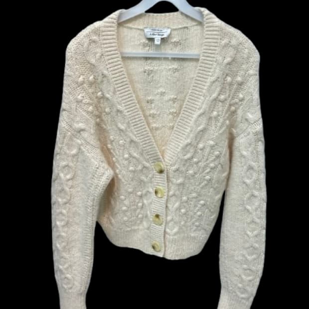 앤아더스토리즈 아이보리 꽈배기 니트 가디건 M