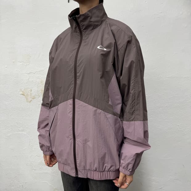 오클리(OAKLEY) 브라운 인디핑크 컬러블록 테크 하이넥 윈드브레이커