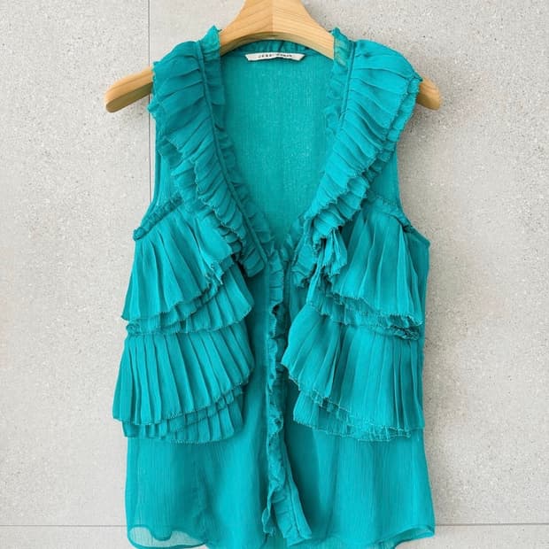 민트색 시스루 쉬폰 슬리브리스 블라우스