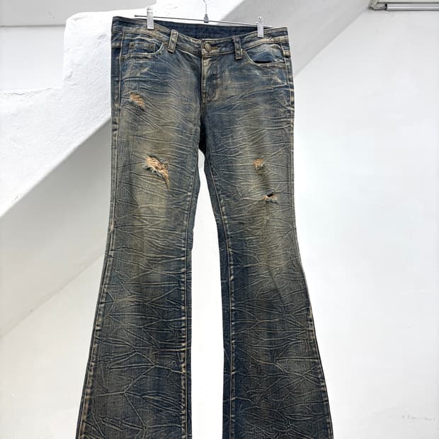 Sand washed scratch flared denim  