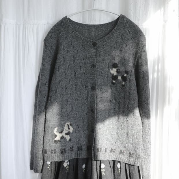 Dog punching cardigan