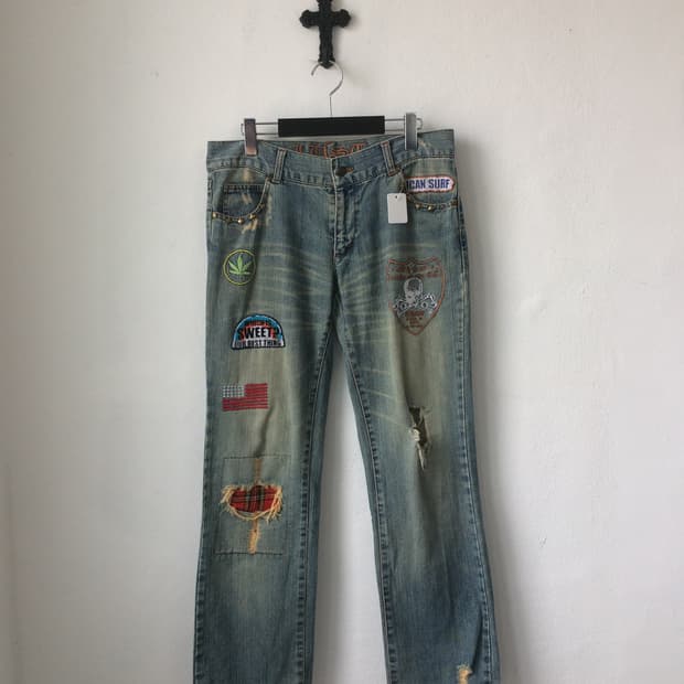 Needle work point damage denim pants