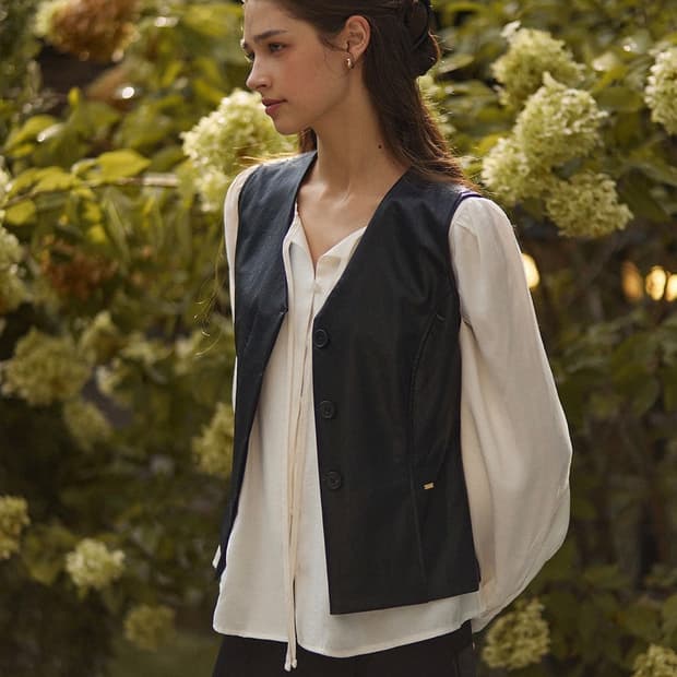 Two pintuck hidden button leather vest