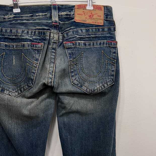 트루릴리젼 샌드워싱 페이퍼택 부츠컷 데님팬츠