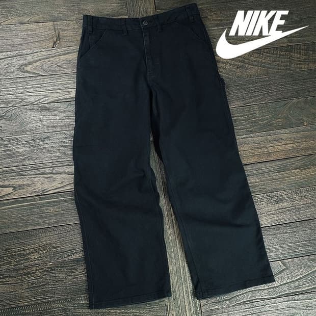 [나이키] 로고 자수 루즈핏 카펜터 팬츠 블랙 M19386