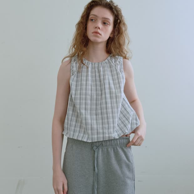 엔조블루스 스트링 슬리브리스 탑 화이트