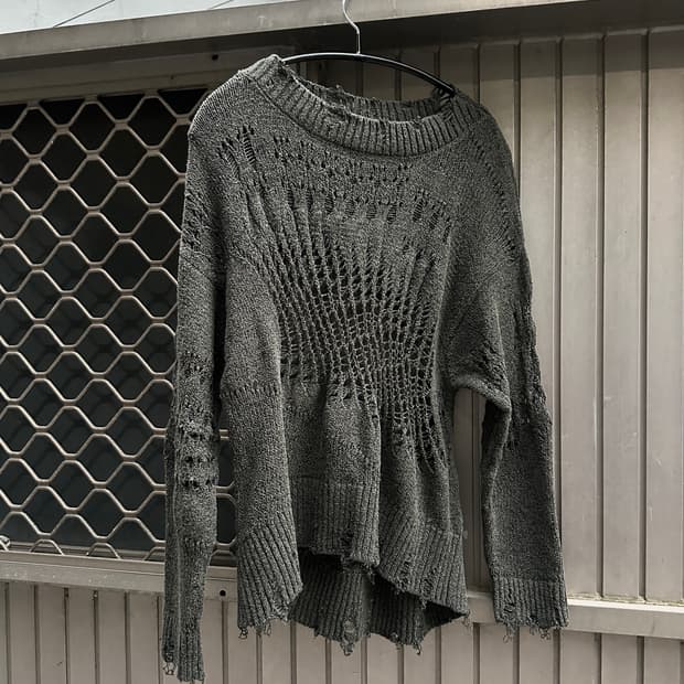 Distressed cut line knit