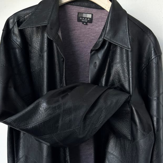 Fake leather irregular panel design shir