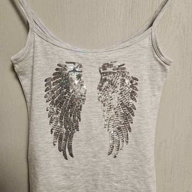 Subdued winged tank top
