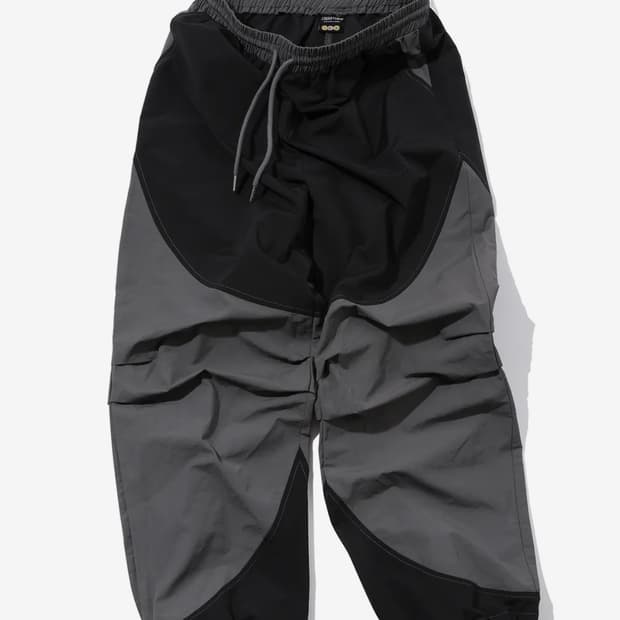 꼼파뇨 라운드 절개 다트 나일론 팬츠 블랙