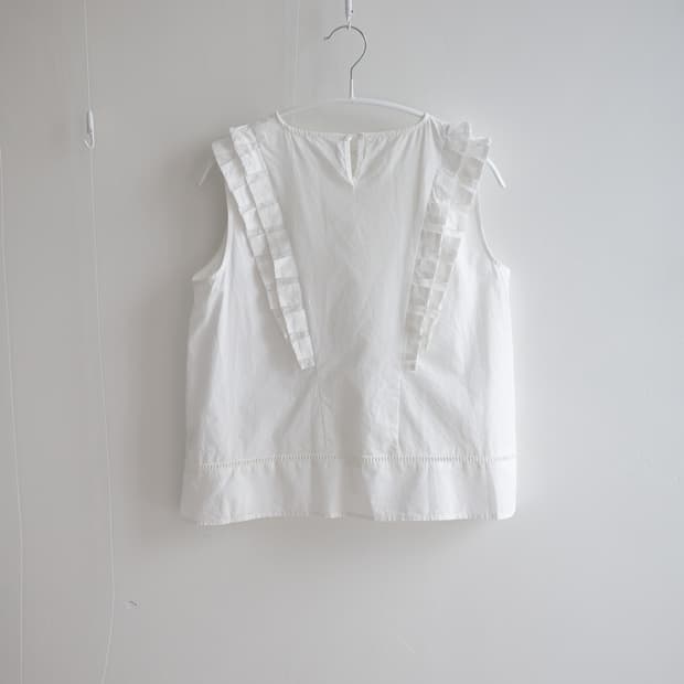White pintuck ruffle sleeveless blouse