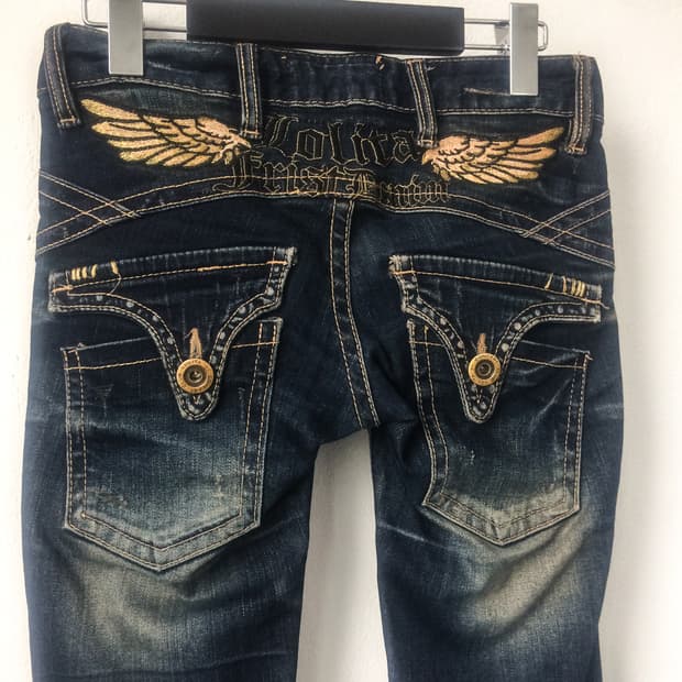 Back wing needle work denim pants