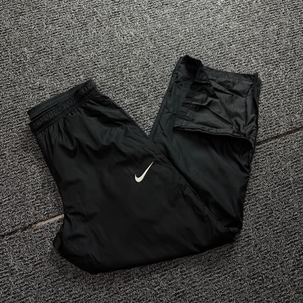 나이키 스톰핏 블랙 와이드 우븐 트랙팬츠 블랙 1823