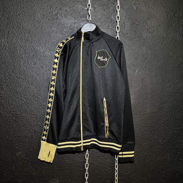 Deux Avril – Black × Gold Track Jersey