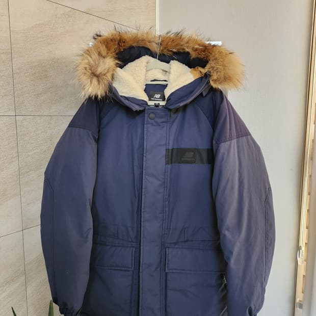 뉴발란스 카메라맨 덕다운 패딩