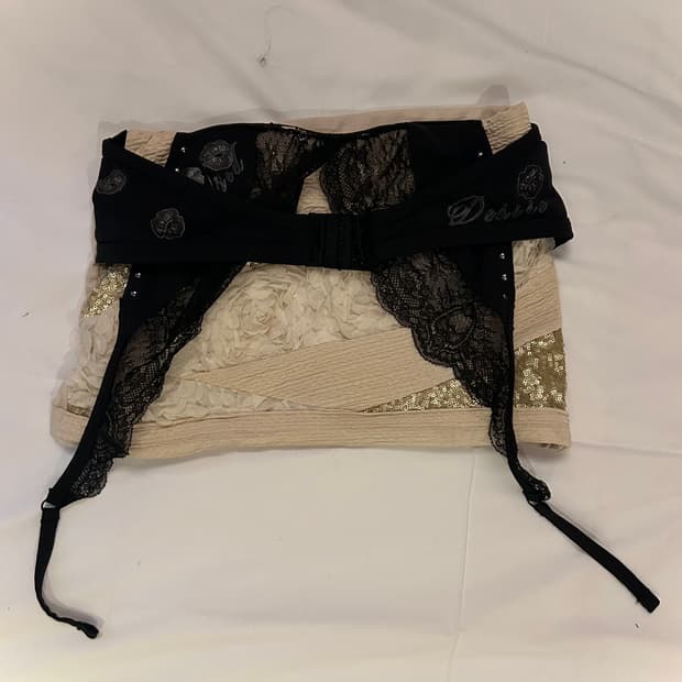 Black bra gold mini skirt