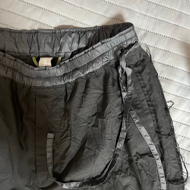 언어펙티드 로우 엣지 컷 와이드핏 트랙팬츠
