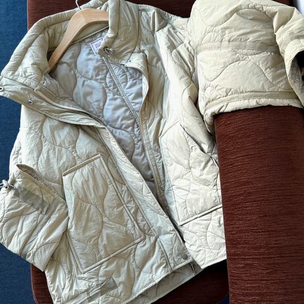 Quilted mil design over blouson jacket