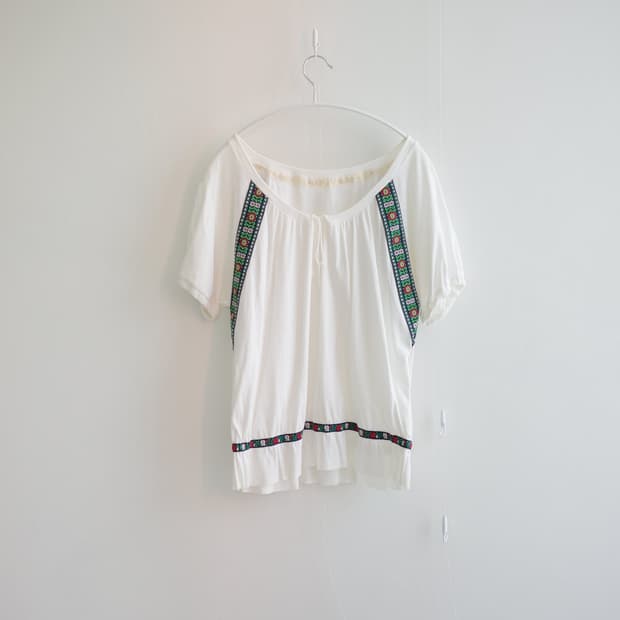 Noggy ecru geometric tape-trim blouse