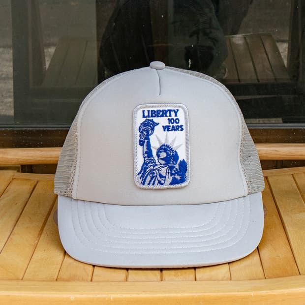 LIBERTY 100 YEARS 매쉬 트러커 캡