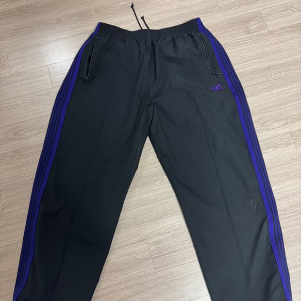 니들스 dc 콜라보 트랙팬츠