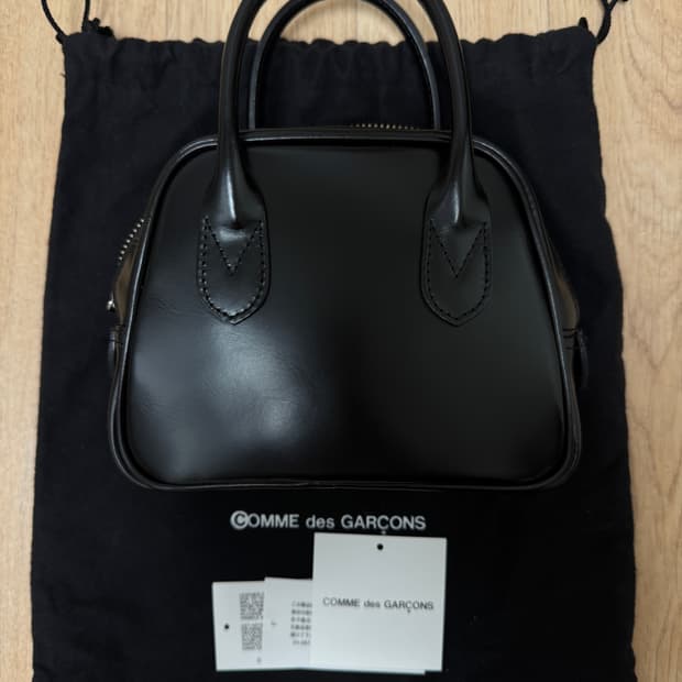 꼼데가르송 아오야마백 라운드 1호