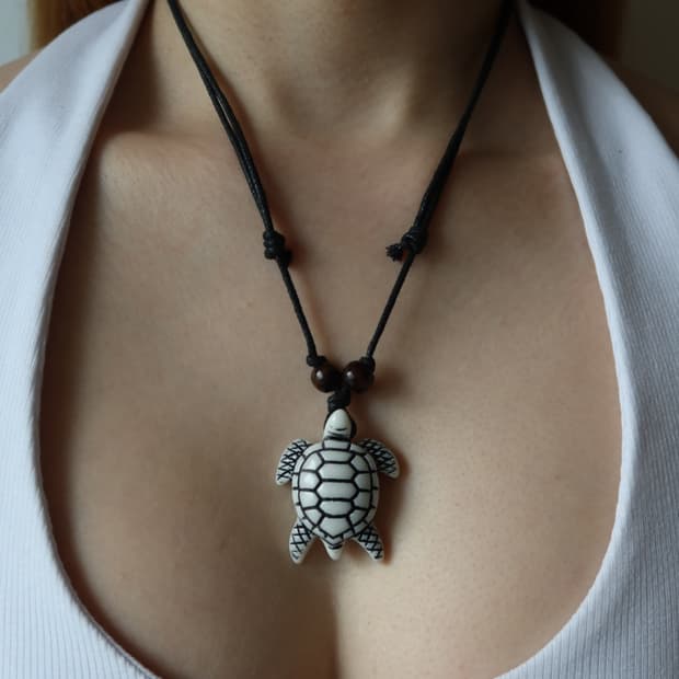 white turtle necklace