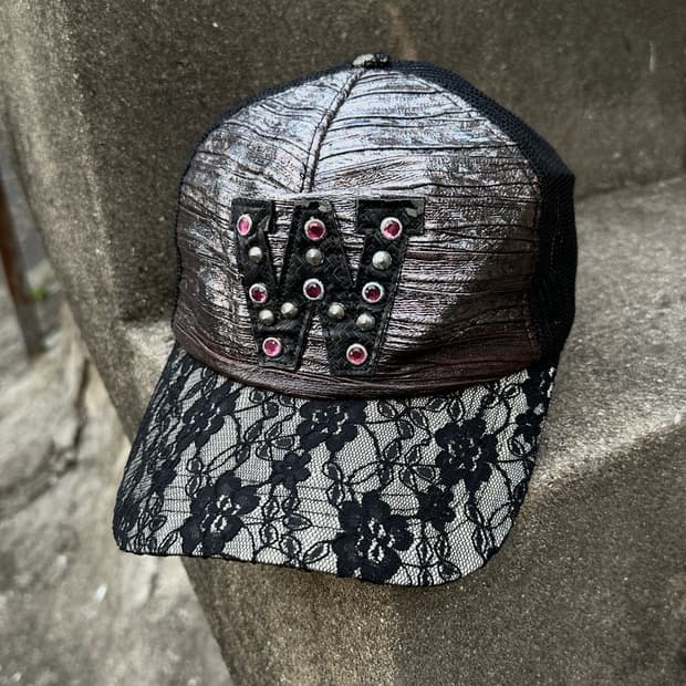 Flower embroidered leather trucker