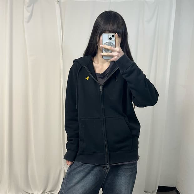 What It Isn’t black zip-up hoodie
