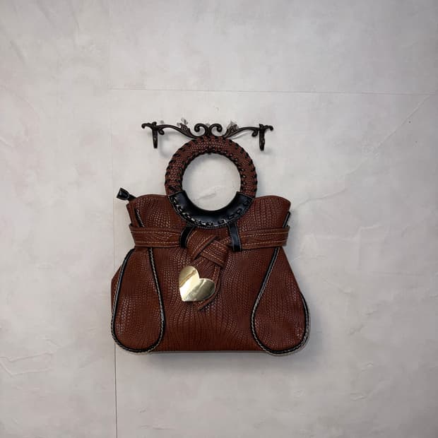 Brown heart charm woven leather tote bag