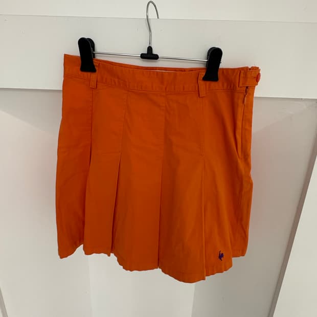 tangerine tennis pleated sk