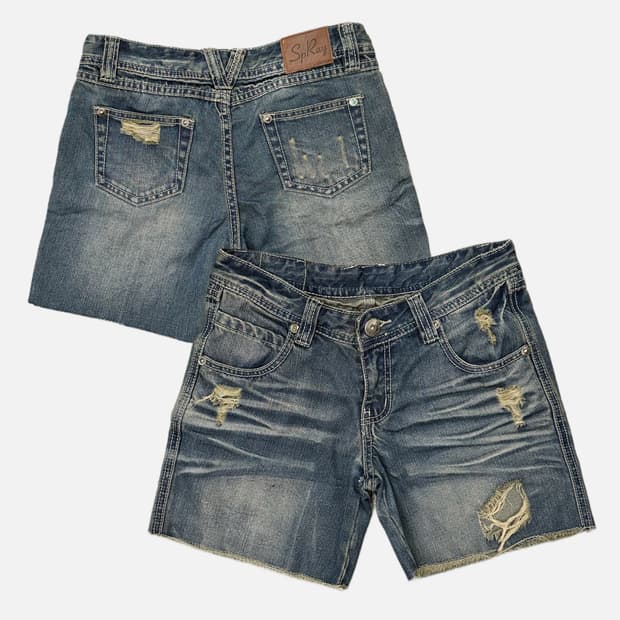 distressed cat washing denim shorts