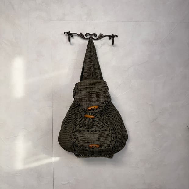 Khaki duffle button net knit backpack 