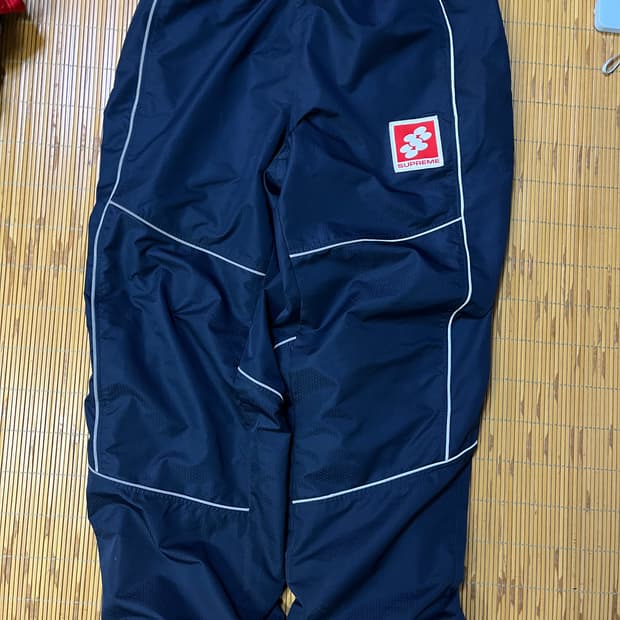 Supreme reflective piping track pants