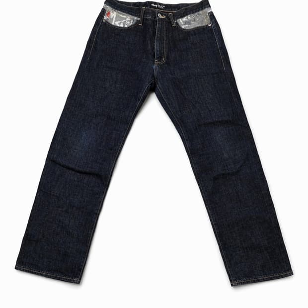 .
STUSSY 백포켓 그래픽 데님 팬츠