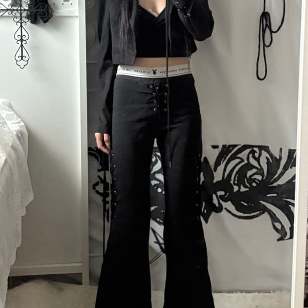 • Black eyelet bootcut pants