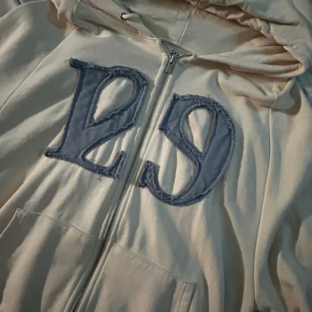 일리고 129 로고 패치 후드 집업 크림