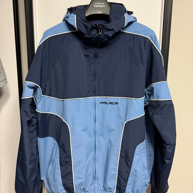 [L] 팔라스 파이프드 후드쉘 자켓 네이비