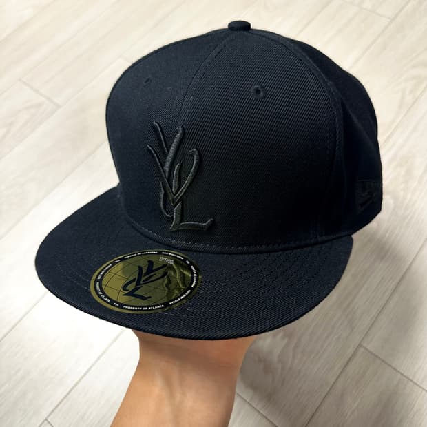 YVL cap   7 7/8 black on black