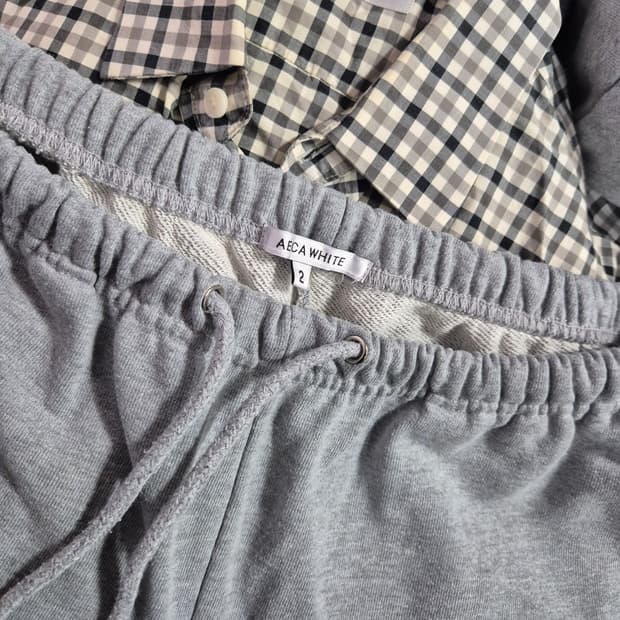 AECA WHITE 회색 트레이닝 조거팬츠