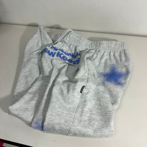 L 스컬프터 멜란지그레이 루즈핏 스프레이 스웻 조거팬츠