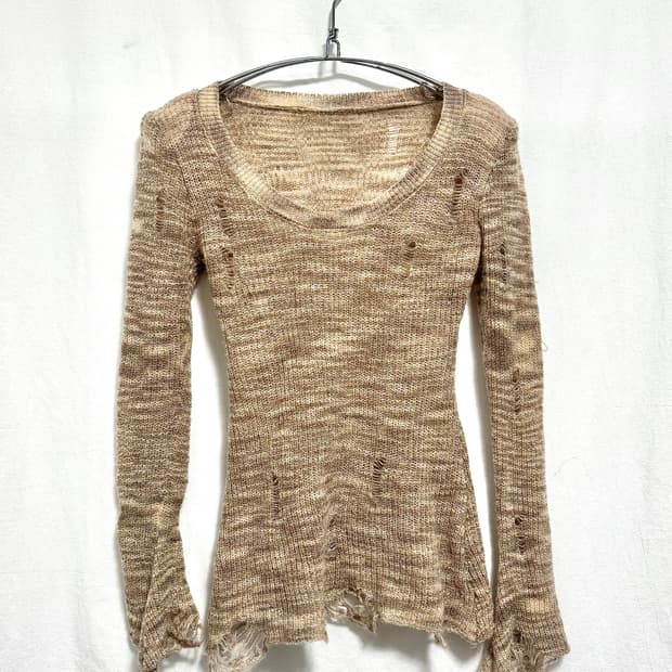 Damaged knit top