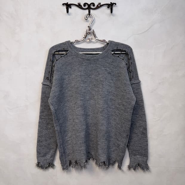 Gray grunge damage destroyed knit