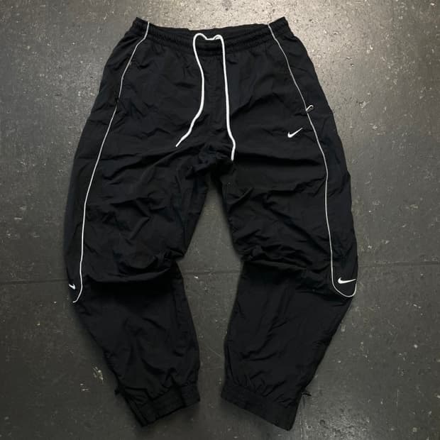 100 나이키 솔로 스우시 우븐 팬츠 