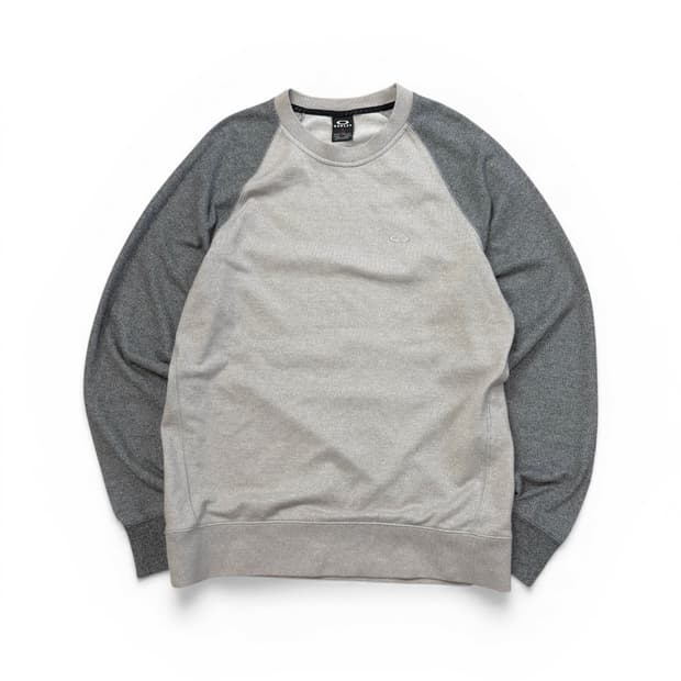 오클리(Oakley)의 그레이 컬러 블록 래글런 스웻셔츠